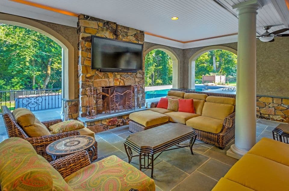 16) Columned Outdoor Living Area with Entertainment Center and Fireplace
