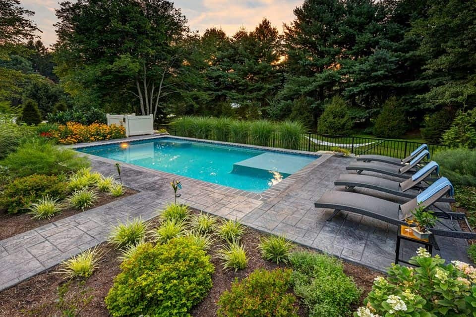 13) Pool with Lounge Area and Flower Beds