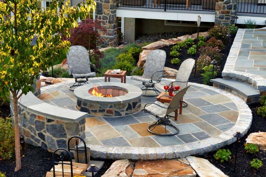 Round-Slate-Patio-with-stone-firepit-and-stone-walls-MILLER