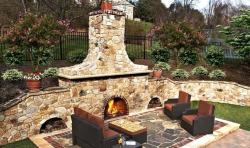 Stone-Fireplace_with-Lumber-Storage-on-Sides-Weigand-768x456