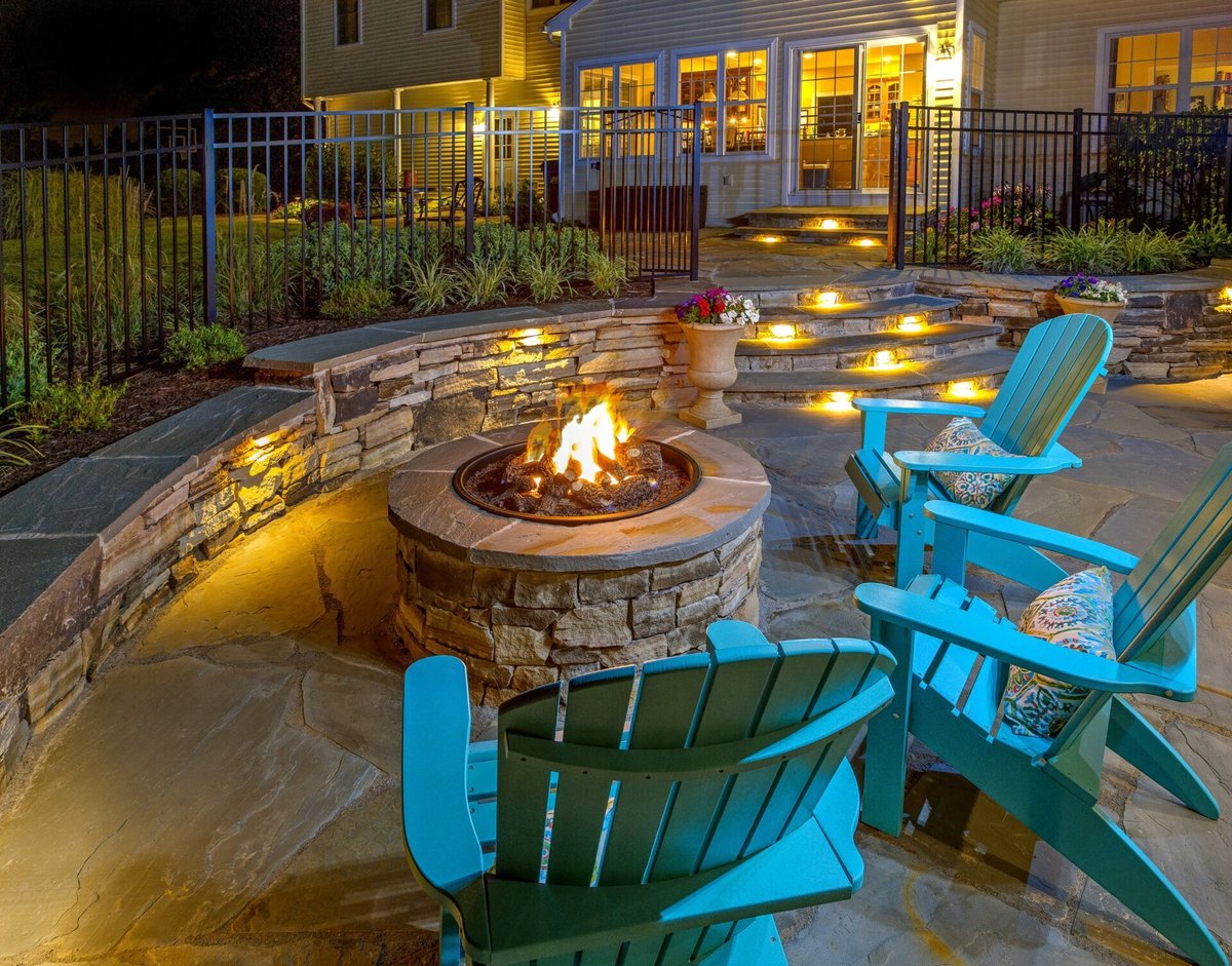 lighted-fire-patio-green-blue-green-adirondack-chairs-min-1920x1506