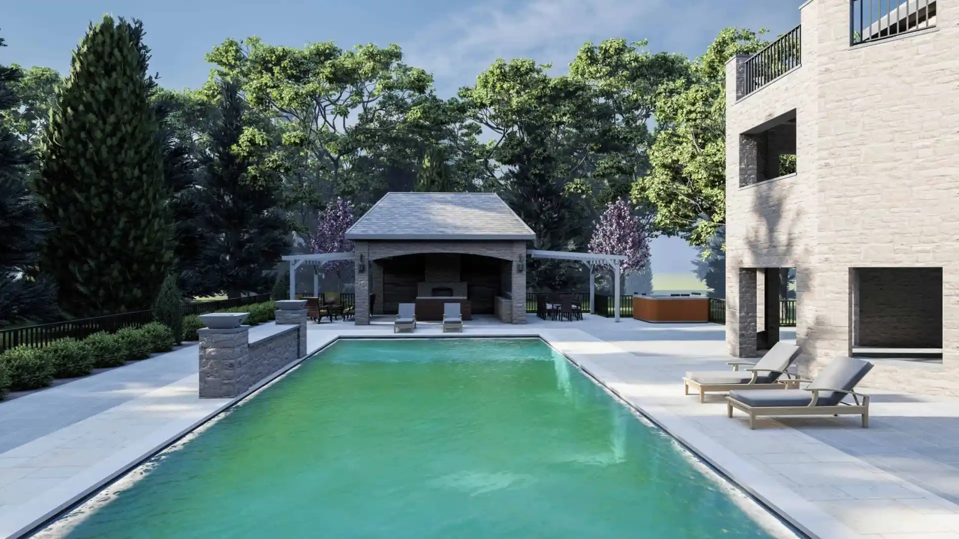 Outdoor living in Delaware County, PA, is enhanced by a clear pool surrounded by stone paving. Two lounge chairs invite relaxation beside the water. In the background, a covered patio with dining and barbecue areas adds to the charm, while lush greenery completes this picturesque setting.