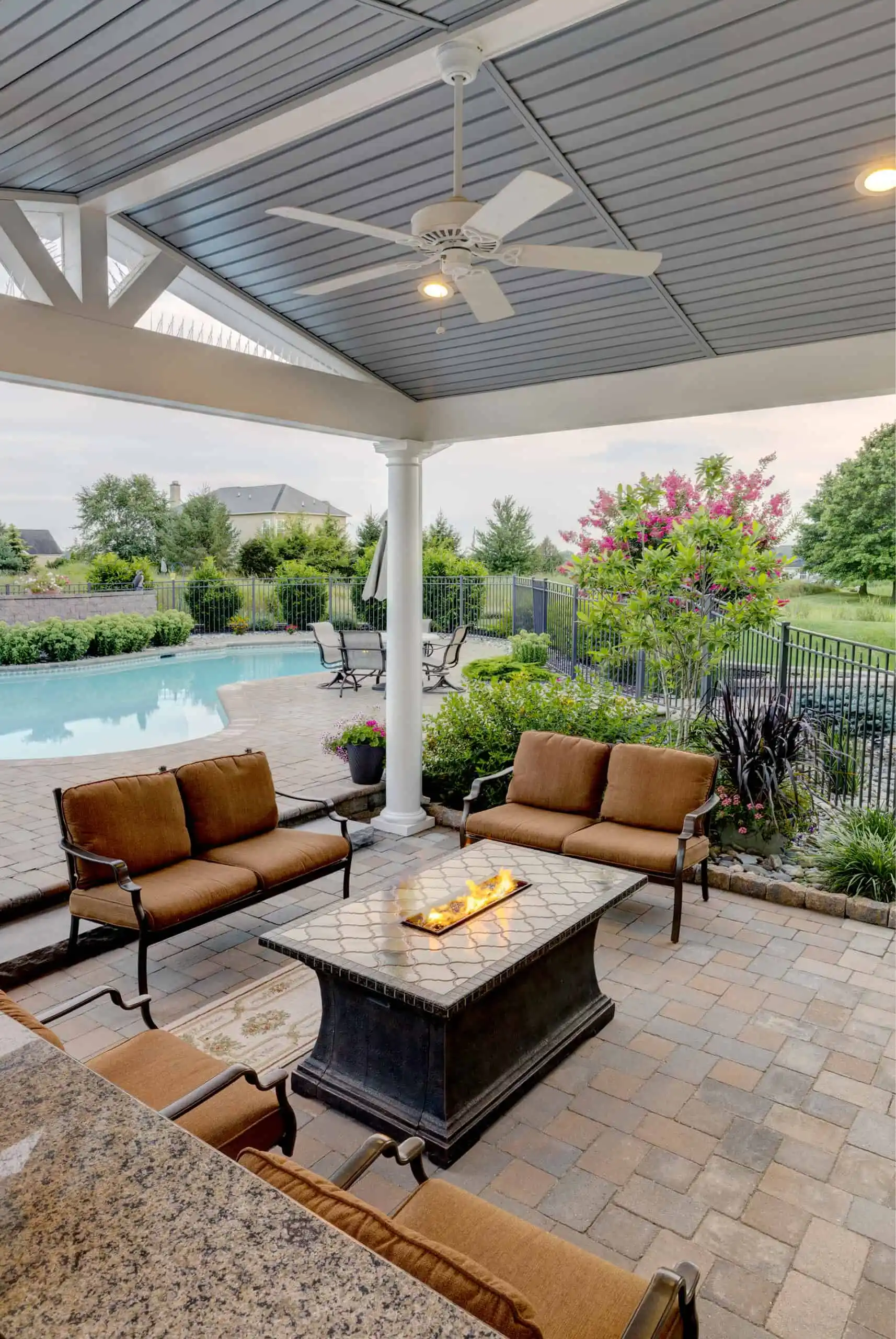 A cozy patio featuring a fire pit surrounded by comfortable seating for relaxation and social gatherings.